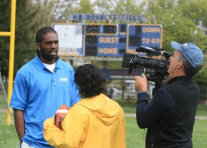 NASCAR Angels crew interviewing Randy Moss at his old high school, DuPont