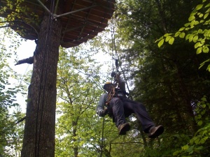 Tree Tops canopy tour guide "Tiny" rappels down 40-feet at the conclusion of the tour